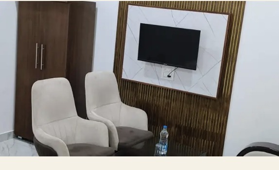 Wardrobe, television and seating in the room